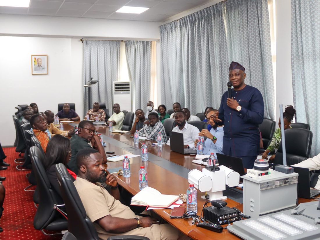 A technical
      briefing on remote monitoring, with monitoring hardware set out on the
      table